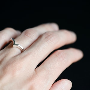 14K white gold chevron wedding band on hand