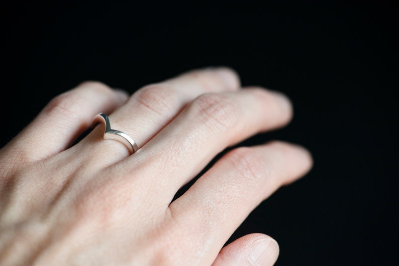14K white gold chevron wedding band on hand