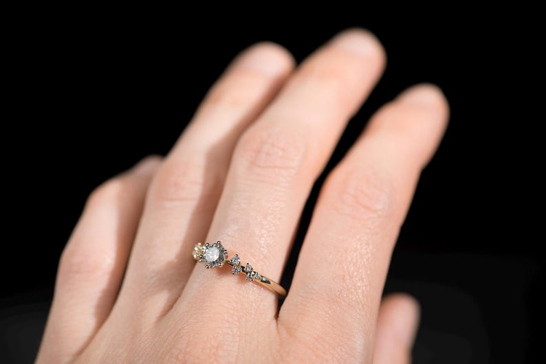 14K gold salt and pepper diamond and white diamonds engagement ring on finger