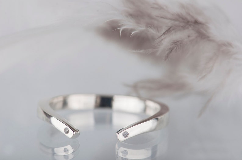 Sterling silver two little diamonds open curved wedding band