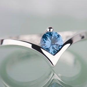 Sterling silver lab created aquamarine chevron ring