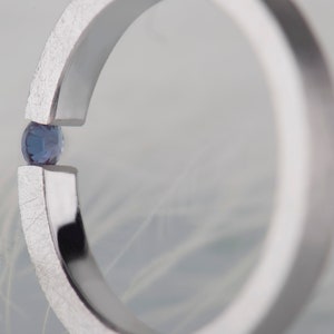 Sterling silver lab created alexandrite tension promise unisex ring