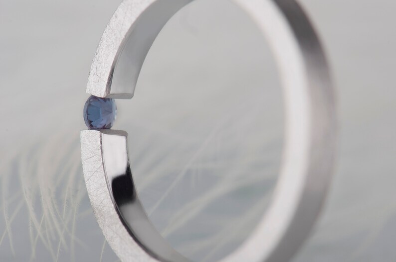 Sterling silver lab created alexandrite tension promise unisex ring