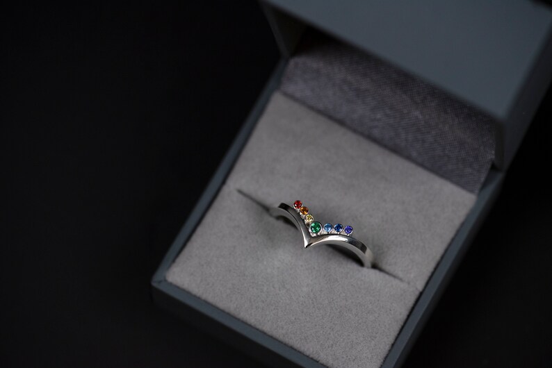 Sterling silver rainbow cubic zirconia enhancer chevron band in a jewelry box