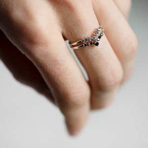 Sterling silver black diamond and alexandrite chevron stacking rings on hand