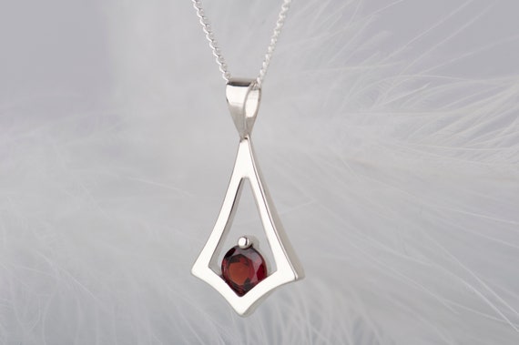 Sterling silver red garnet kite pendant necklace