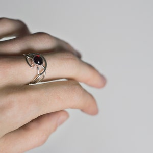 Sterling silver natural red garnet twisted ring on hand