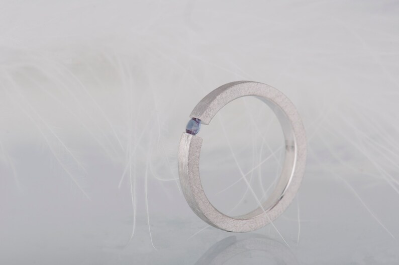 Sterling silver lab created alexandrite tension promise unisex ring