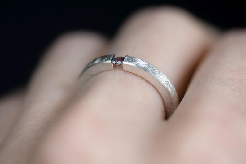 Sterling silver lab created alexandrite tension promise unisex ring onfinger