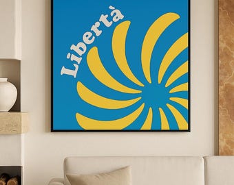 Peut inclure: Une œuvre d'art murale carrée dans un cadre noir fin présentant un fond bleu vif avec un grand motif de rayons de soleil jaune rayonnant depuis le centre. Le texte blanc "Libertà" est imprimé dans une police grasse et incurvée en haut à gauche.