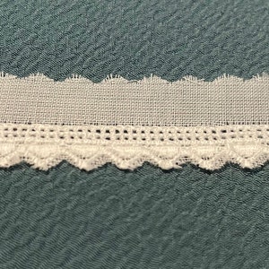 Embroidered edge on  white Batiste, made in Switzerland, 3/4&quot;.