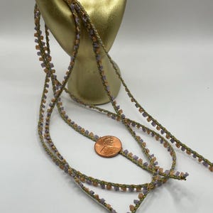 Picot edge ribbon trim, two colors, 1/4”. Peach and lavender.