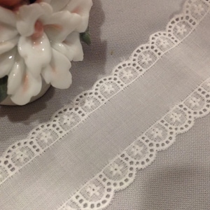 1y, Embroidered, Swiss, white on white Batiste, 100% cotton, 1 1/2 wide