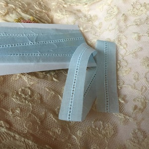 1 yard cuts of blue Entredeux on blue Swiss Batiste, 5/8&quot; wide,  100% cotton.