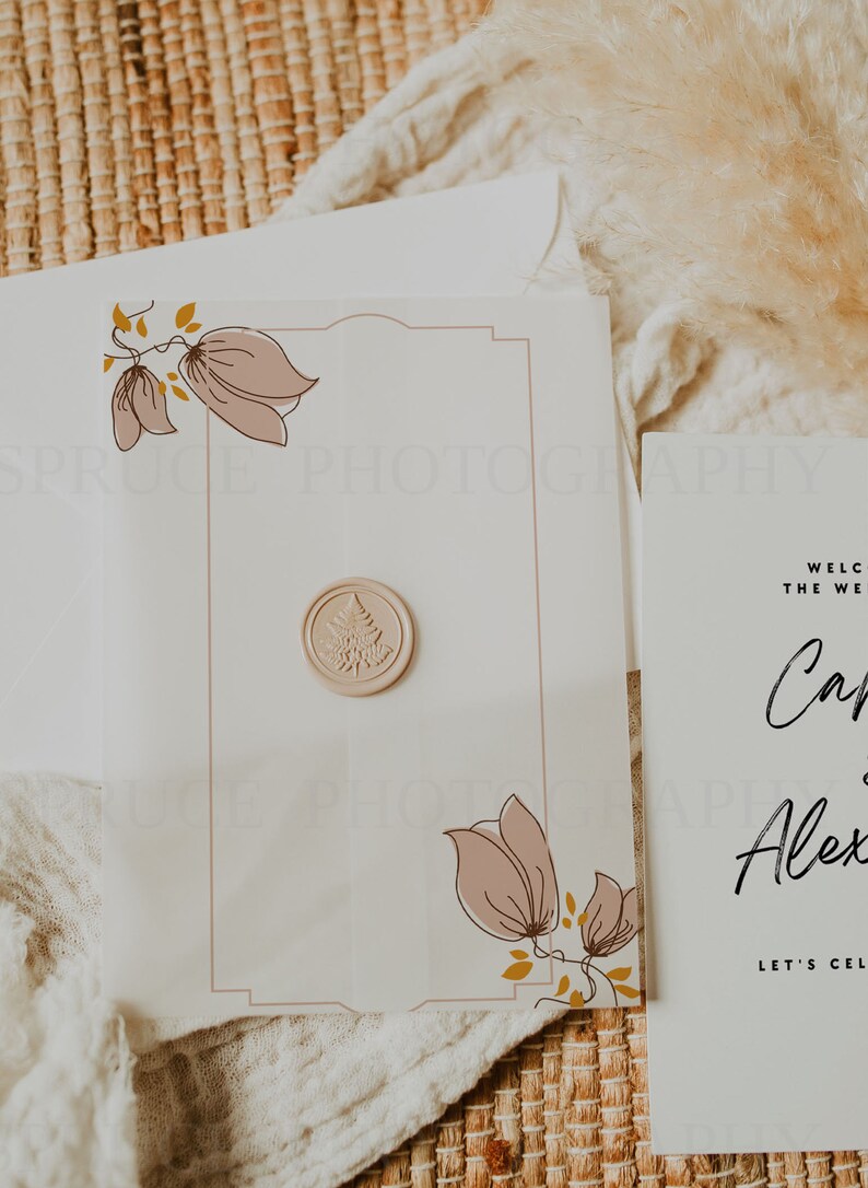 May include: A white wedding invitation with a floral design and a wax seal. The invitation reads "Welcome to the wedding of...  Let's Celebrate!"