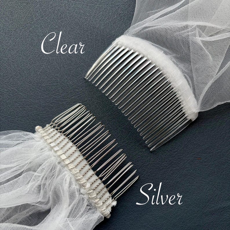 May include: Two bridal veil combs with silver metal teeth and attached white tulle. The word "Clear" is written in cursive on the top left, and the word "Silver" is written on the bottom right.