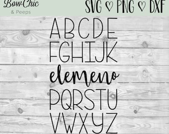 Puede incluir: Una fuente de alfabeto en blanco y negro con un estilo de escritura a mano. Las letras se muestran en dos filas, con la palabra "elemento" escrita en cursiva entre las filas.