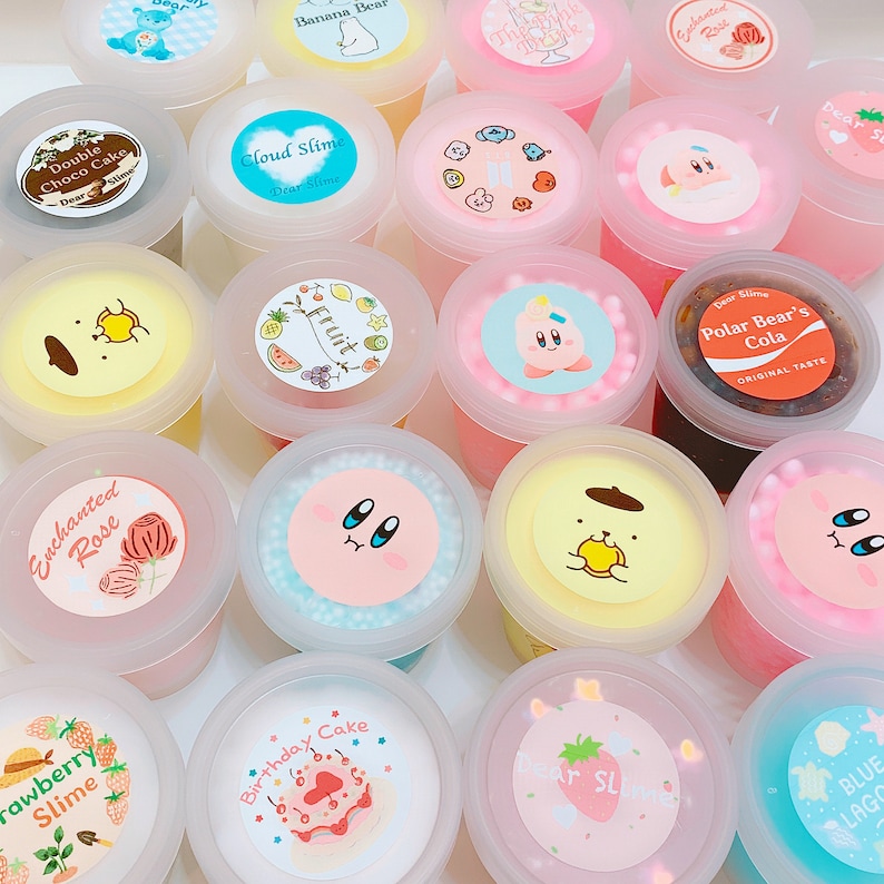 May include: Assortment of colorful slime jars with various cartoon character and themed designs.  The slime jars are labeled with names like "Double Choco Cake", "Cloud Slime", "Enchanted Rose", "Birthday Cake", "Polar Bear's Cola", "Fruit", "Strawberry Slime", "Blue Lagoon", and "Dear Slime".