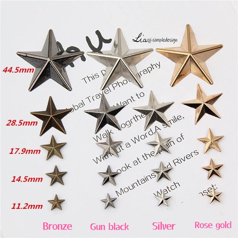 May include: Assortment of five-pointed star-shaped metal embellishments in bronze, gun black, silver, and rose gold finishes. The stars range in size from 11.2 mm to 44.5 mm.