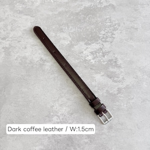 May include: A dark coffee brown leather watch strap featuring tonal stitching along the edges, two leather keepers, and a silver-toned metal buckle. The strap has a width of 1.5 cm as indicated by the text overlay on the image.