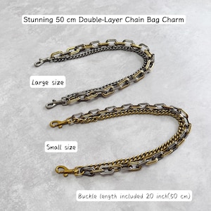 May include: Two double-layer chain bag charms, labeled as large and small sizes. Each chain features a combination of gold and silver-toned metal links with lobster claw clasps at both ends. Text reads: Stunning 50 cm Double-Layer Chain Bag Charm, Large size, Small size, and Buckle length included 20 inch(50 cm).
