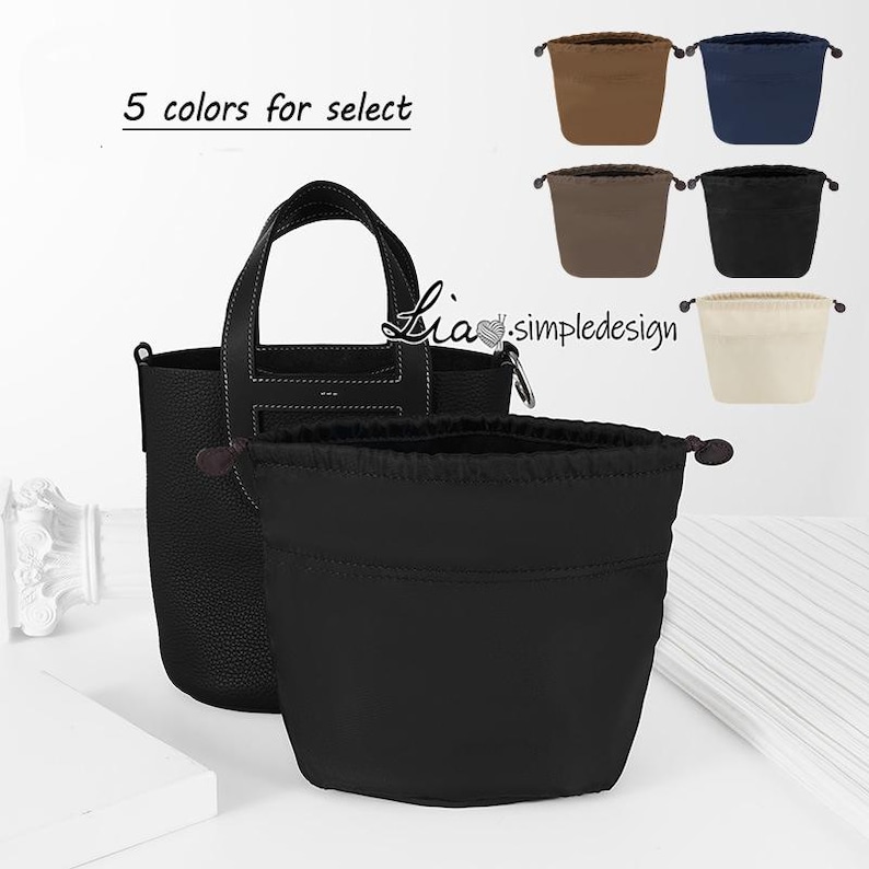 May include: A black leather tote bag with a top handle and a drawstring pouch inside. The pouch is available in five colours: brown, navy blue, beige, grey, and black. The text "5 colours for select" is visible in the image.