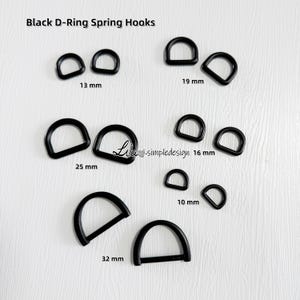 Puede incluir: Surtido de ganchos de resorte de anillo en D negros en varios tamaños: 10 mm, 13 mm, 16 mm, 19 mm, 25 mm y 32 mm.