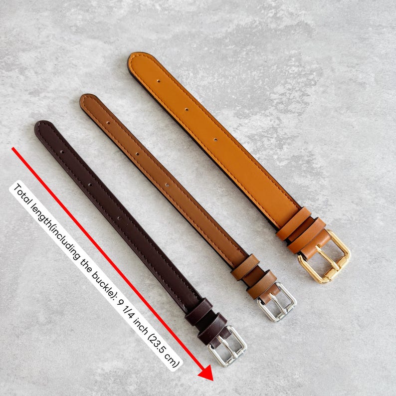 May include: Three watch straps in dark brown, medium brown, and tan, each featuring a metal buckle and a total length of 9 1/4 inches. The straps have stitched edges and multiple adjustment holes, with the dark brown strap showing the length.