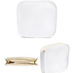 May include: White square cosmetic bag with a gold zipper. The bag is shown from multiple angles, including a top-down view and a side view. The word "white" is printed at the top of the image.