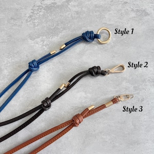 May include: Three leather straps in blue, black, and brown, each with a different clasp and knot design. Style 1 has a gold ring, Style 2 a gold clasp, and Style 3 a gold clasp. The text "Style 1", "Style 2", and "Style 3" are visible.