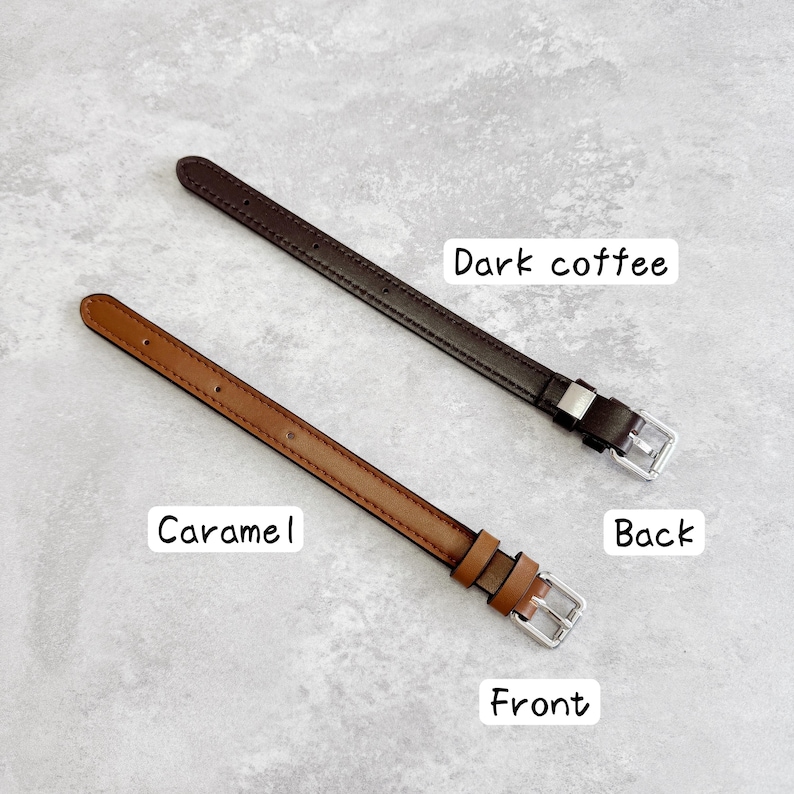 May include: Two thin leather watch straps with silver-toned metal buckles. One strap is dark coffee brown labeled "Dark coffee" and "Back," while the other is a lighter caramel brown labeled "Caramel" and "Front," featuring visible stitching.