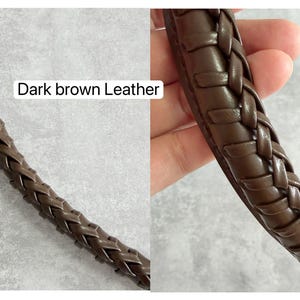 May include: Close-up of a dark brown leather strap with a braided design. The text "Dark brown Leather" is visible in the image. The leather appears smooth and the braid is tightly woven.