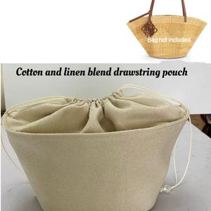 May include: A beige cotton and linen blend drawstring pouch, designed as an insert for a basket bag. The text "Fit 'Lower small/large basket bag' insert" and "Bag not included" are visible. The pouch has a drawstring closure.