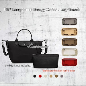 May include: A black Longchamp Energy XS/S/L bag with a matching black insert. The image displays several coloured inserts: grey, beige, brown, clear, and red. The text reads "Fit Longchamp Energy XS/S/L Bag insert". The bag is not included.