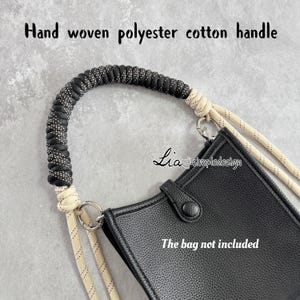 May include: Handwoven black and white polyester cotton handle with a beige cotton rope. The bag is not included.  The handle is attached to two silver rings.