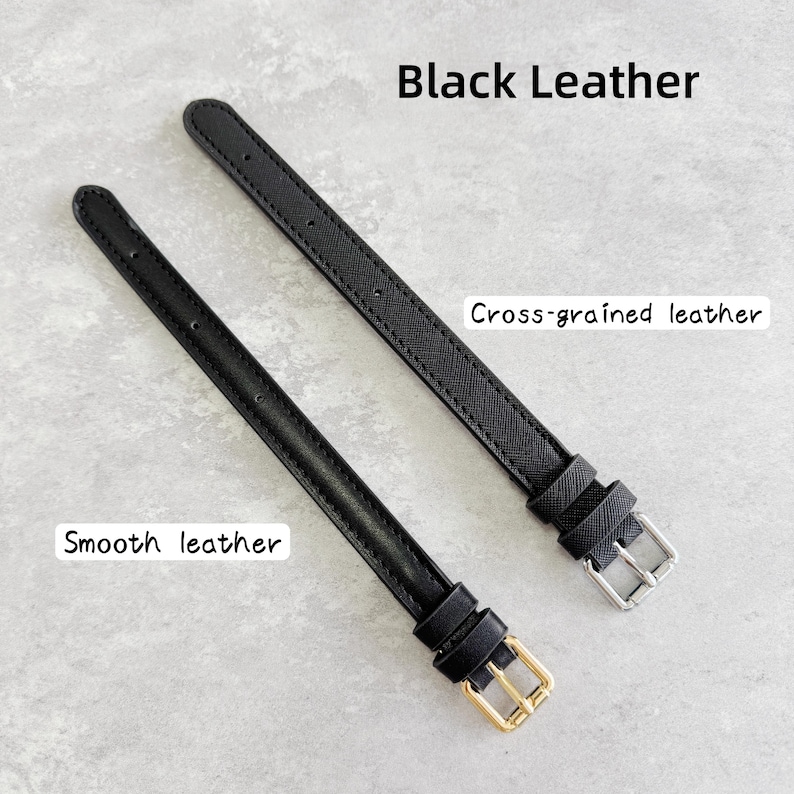 May include: Two black leather watch straps. One strap features a smooth texture with a gold-tone buckle, while the other has a cross-grained texture with a silver-tone buckle. Both straps include multiple adjustment holes and two leather keepers.