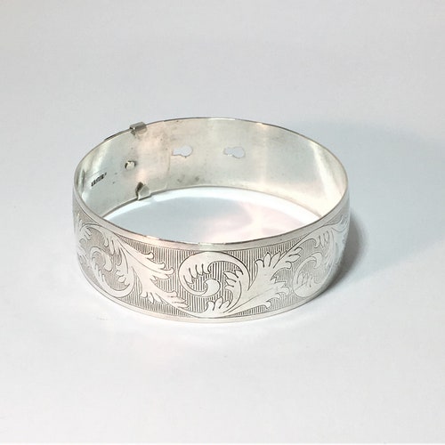 Vintage Silver Engraved deals Belt Style Bangle. Marked Silver. Floral Leaf Design, 21 grams. Excellent Vintage Condition. Adjustable.