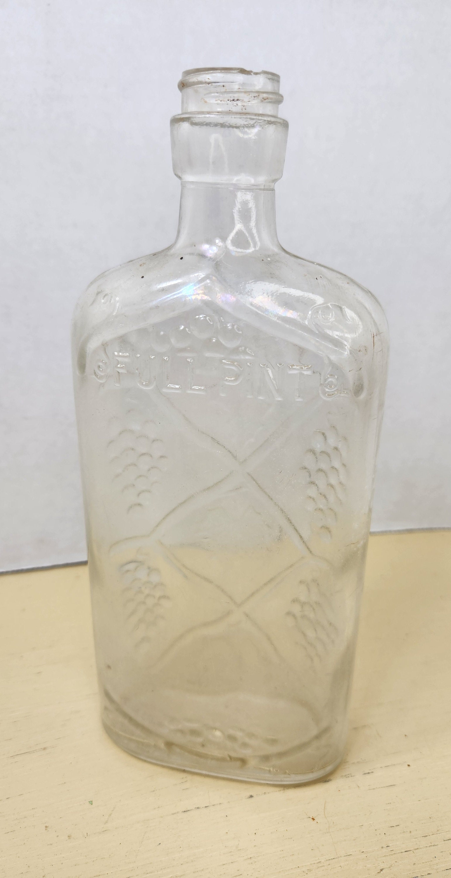 Vintage Wine 228 Full Pint Bottle With Embossed Grapes
