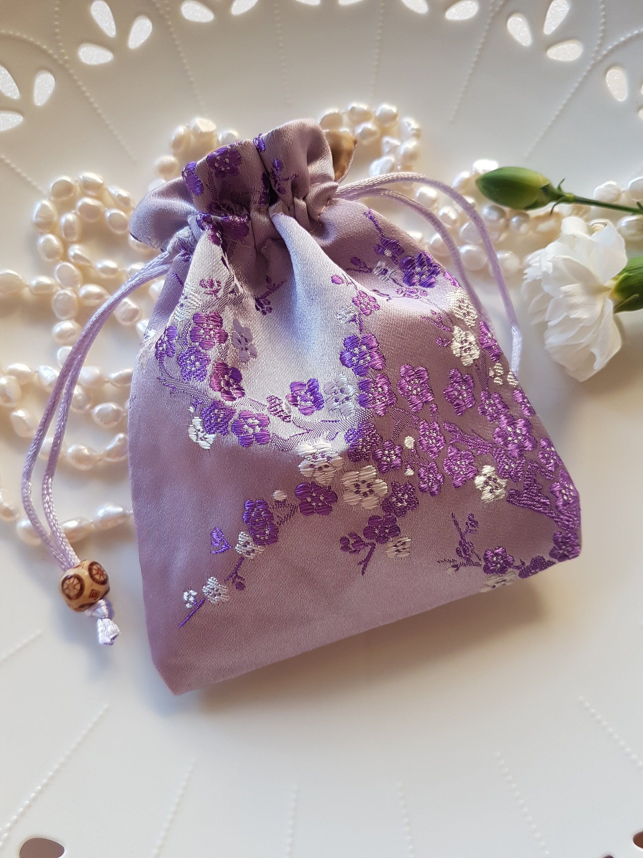 ROUND DRAWSTRING POUCH WITH BEADING LUXE NAVY main image 0