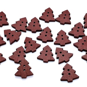 May include: A collection of dark brown wooden buttons shaped like Christmas trees. Each button has three holes for sewing. The buttons are scattered on a white background, ideal for crafting and holiday projects.