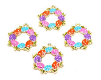 May include: Four circular charms featuring a wreath design made of colorful enameled eggs in shades of orange, blue, purple, and pink. Each charm has a gold-toned metal border and a small loop at the top for attachment, with green leaf accents.