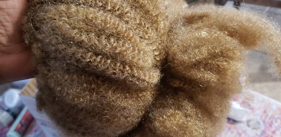 Afro up do. Gold