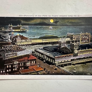 Cartolina d'epoca Atlantic City N J Panorama dei moli di notte