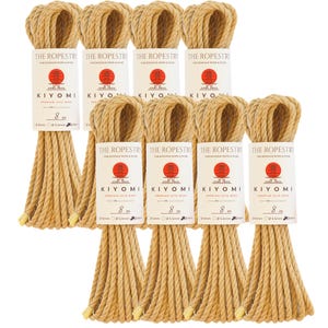 May include: Bundles of natural-colored jute rope, labeled "KIYOMI" and "THE ROPESTRY". Each bundle is 8 m long, with a diameter of 6mm and 5.5mm. The labels feature a red sun design. The rope is tightly wound and ready for use.