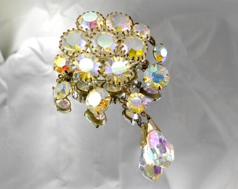 Aurora Borealis and Topaz Rhinestone 1950s Vintage brooches. The brooch. An ancient brooch. Brooch with multi-colored stones.