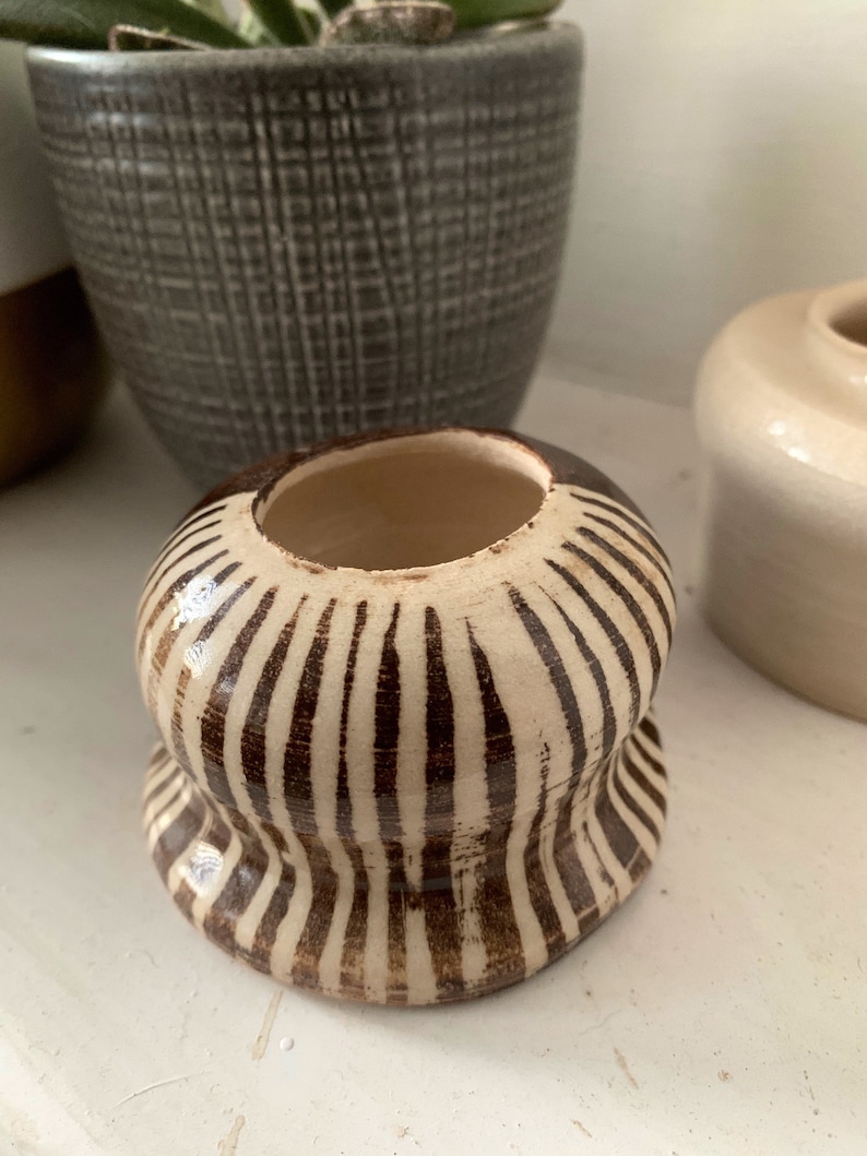 Small hand thrown stonewear ceramic vase in chocolate brown and striped pattern