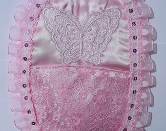 Custom designed embroidered colostomy bag cover.