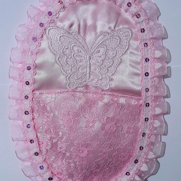 Custom designed embroidered colostomy bag cover.