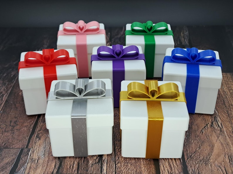 gift card holder boxes are shown in white with silver, green, red, blue, purple, pink and gold ribbons