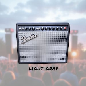 May include: A black and light gray Fender amplifier with a silver speaker grill. The amplifier has several knobs and a red light. The word "Fender" is written in cursive on the front. The text "LIGHT GRAY" is written below the amplifier.
